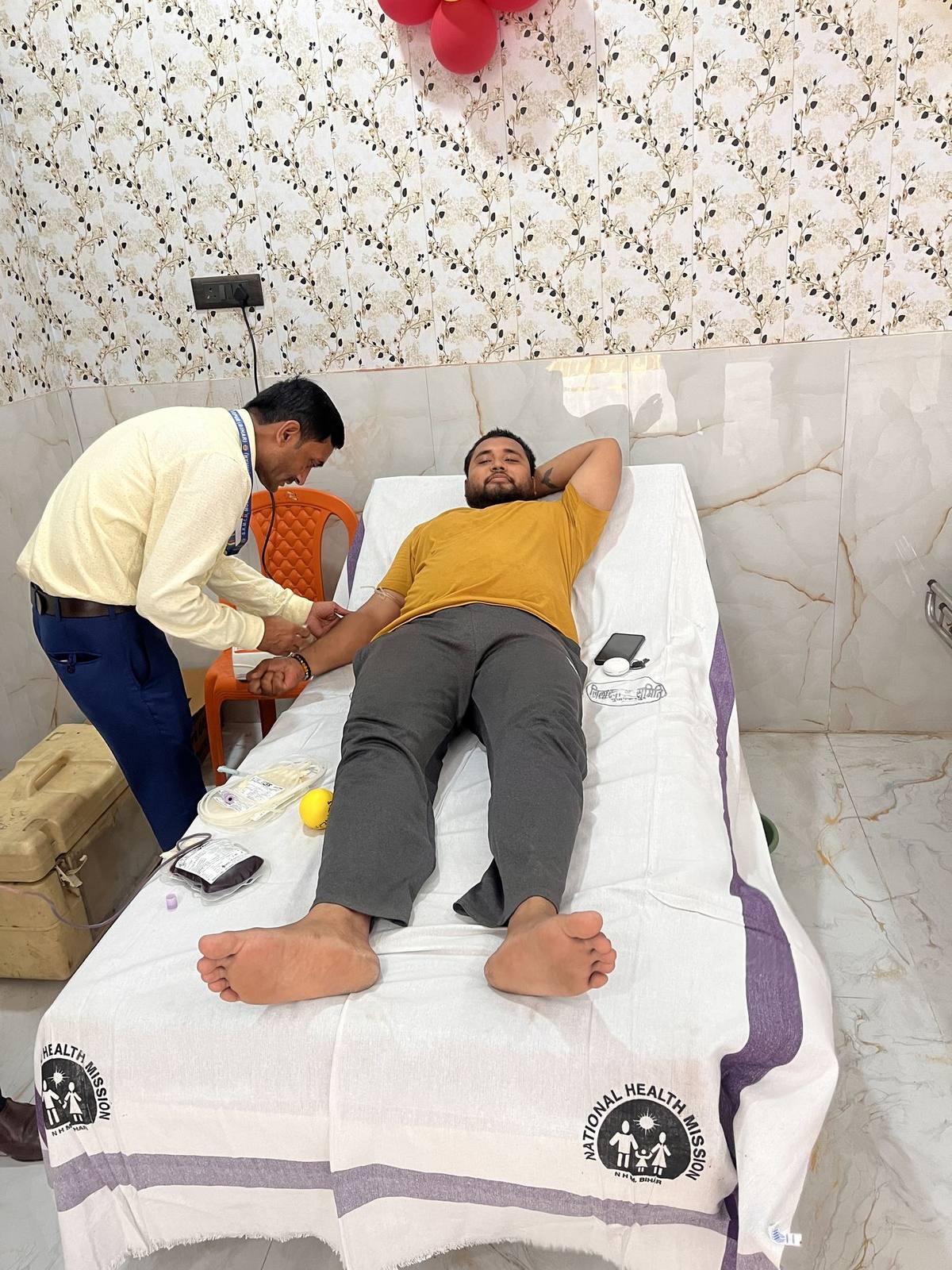 Medical staff drawing blood from a donor at the Mega Blood Donation Camp, Motipur
